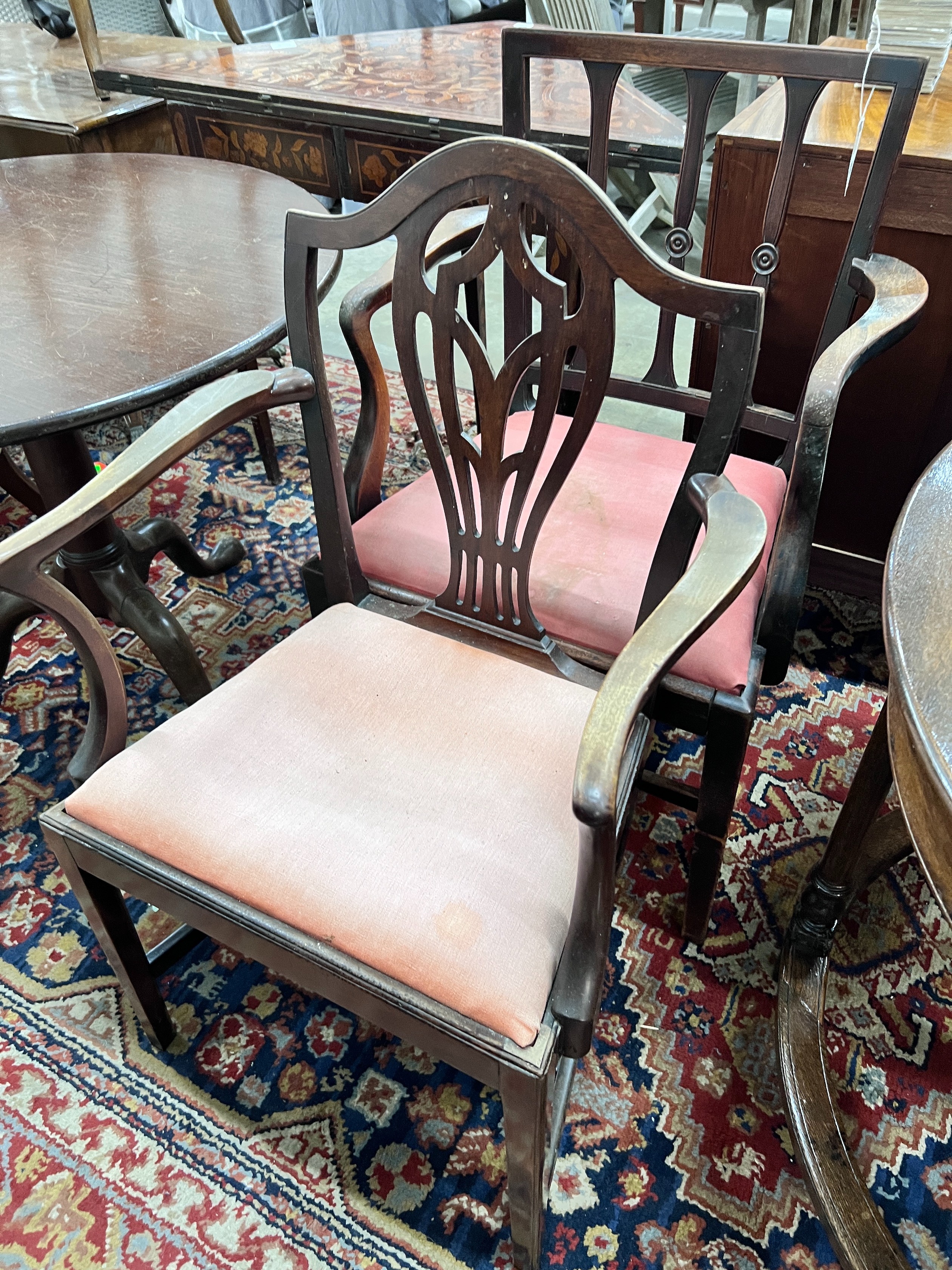 A George III provincial mahogany elbow chair together with a later elbow chair *Please note the sale commences at 9am.